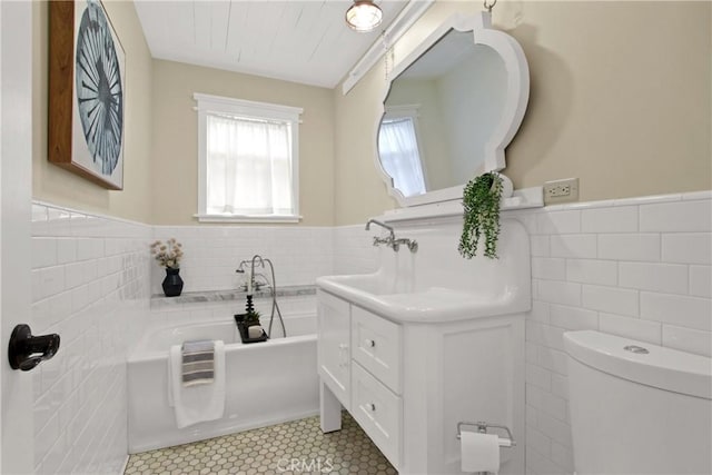 4841 E Los Coyotes Diagonal, Long Beach, CA 90815 - full bath with tile walls, a garden tub, a wainscoted wall, vanity, and tile patterned floors