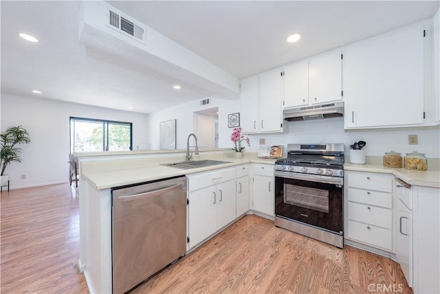 13801 Shirley St Unit 14, Garden Grove, CA 92843 - kitchen featuring appliances with stainless steel finishes, under cabinet range hood, light wood-type flooring, a peninsula, and recessed lighting