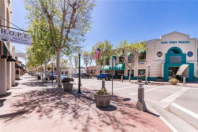 13801 Shirley St Unit 14, Garden Grove, CA 92843 - view of asphalt road with sidewalks, curbs, street lighting, and traffic signs