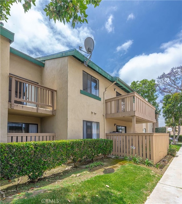 13801 Shirley St Unit 14, Garden Grove, CA 92843 - view of home's exterior featuring stucco siding and a balcony