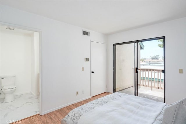 13801 Shirley St Unit 14, Garden Grove, CA 92843 - bedroom with access to outside, connected bathroom, and light wood finished floors