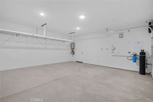 1649 Spring Run Ln, Beaumont, CA 92223 - garage featuring water heater and recessed lighting