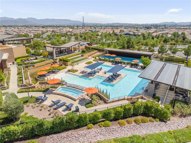 1649 Spring Run Ln, Beaumont, CA 92223 - aerial perspective of suburban area with a pool and a mountain backdrop