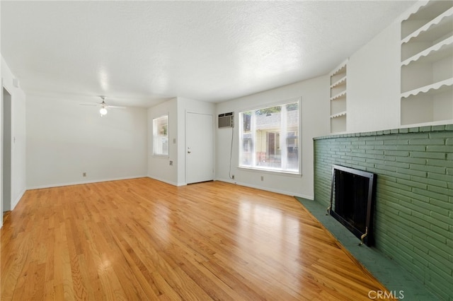 2723 57th St, Sacramento, CA 95817 - unfurnished living room with a brick fireplace, a ceiling fan, and light wood-type flooring