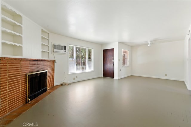 2723 57th St, Sacramento, CA 95817 - unfurnished living room with a fireplace, a wall mounted air conditioner, built in shelves, ceiling fan, and finished concrete flooring