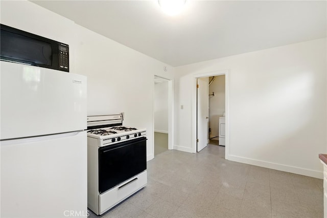 2723 57th St, Sacramento, CA 95817 - kitchen with white appliances and washer / clothes dryer