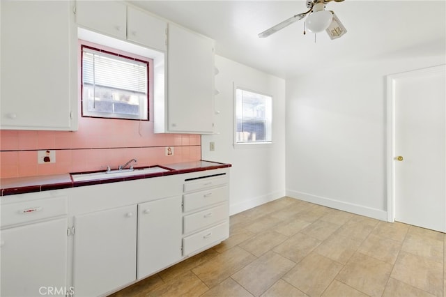 2723 57th St, Sacramento, CA 95817 - kitchen with tile countertops, white cabinets, decorative backsplash, and ceiling fan