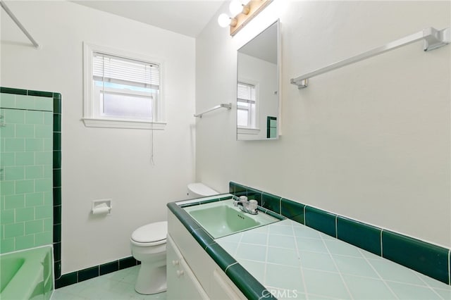 2723 57th St, Sacramento, CA 95817 - bathroom with vanity, washtub / shower combination, and tile patterned floors