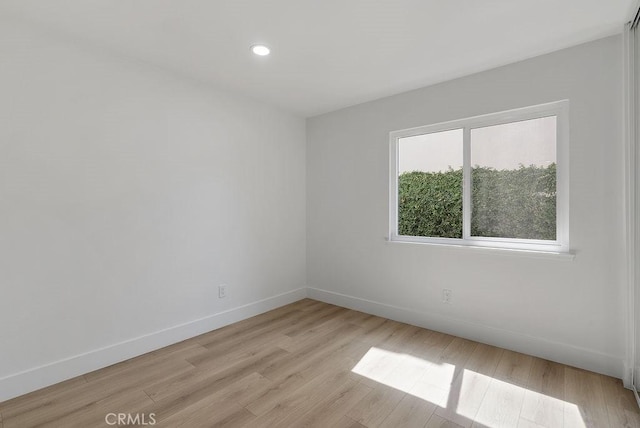 13020 Beach St, Cerritos, CA 90703 - empty room with light wood-style flooring and recessed lighting