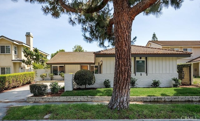 13020 Beach St, Cerritos, CA 90703 - view of front of house featuring a tile roof and brick siding