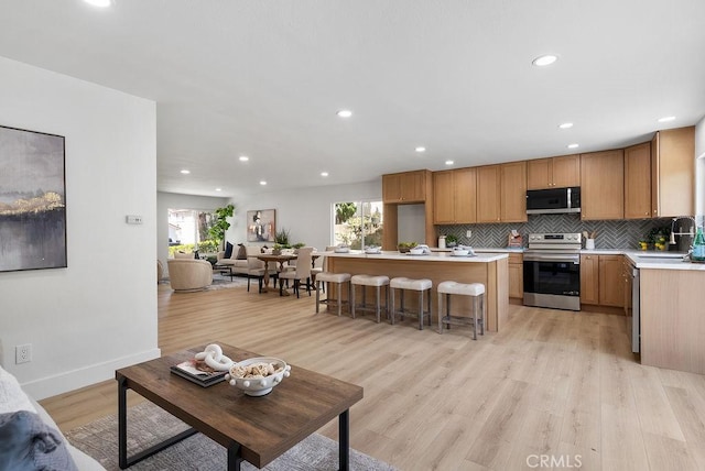 13020 Beach St, Cerritos, CA 90703 - living area with healthy amount of natural light, recessed lighting, and light wood-type flooring