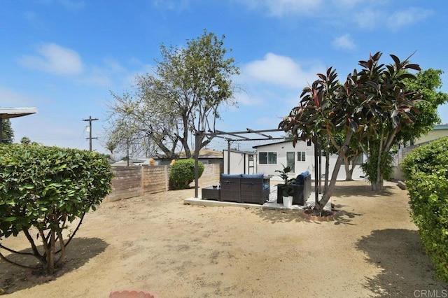 6127 Winchester St, San Diego, CA 92139 - fenced backyard featuring an outdoor living space and a patio