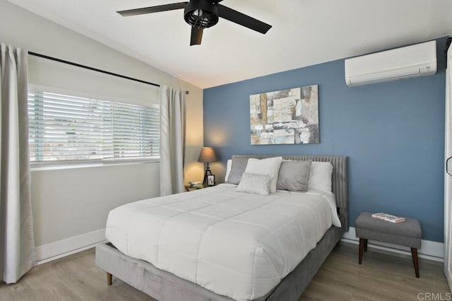 6127 Winchester St, San Diego, CA 92139 - bedroom with a wall mounted AC, lofted ceiling, wood finished floors, and ceiling fan