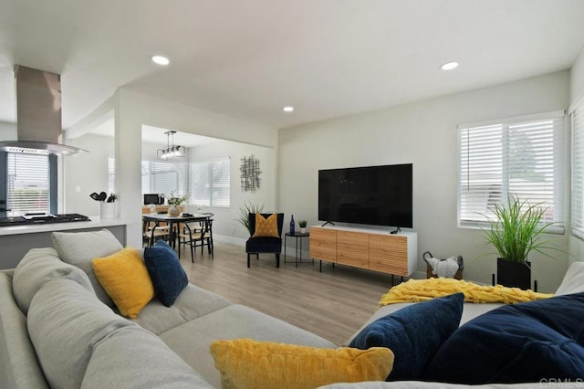 6127 Winchester St, San Diego, CA 92139 - living room featuring wood finished floors, a chandelier, and recessed lighting