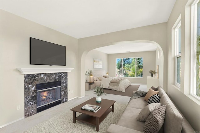 43883 Brookhaven Ct, Temecula, CA 92592 - living area with arched walkways, carpet flooring, and a fireplace