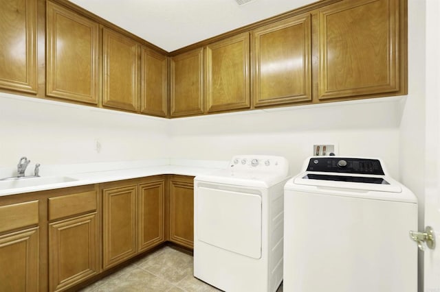 43883 Brookhaven Ct, Temecula, CA 92592 - laundry room with washer and clothes dryer, cabinet space, and light tile patterned floors