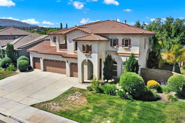 43883 Brookhaven Ct, Temecula, CA 92592 - mediterranean / spanish home featuring stucco siding, a tile roof, driveway, an attached garage, and a front yard