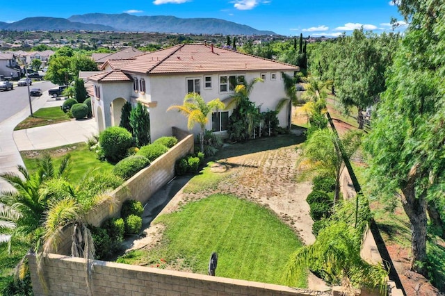 43883 Brookhaven Ct, Temecula, CA 92592 - view of front facade with driveway, stucco siding, a tiled roof, and a mountain view