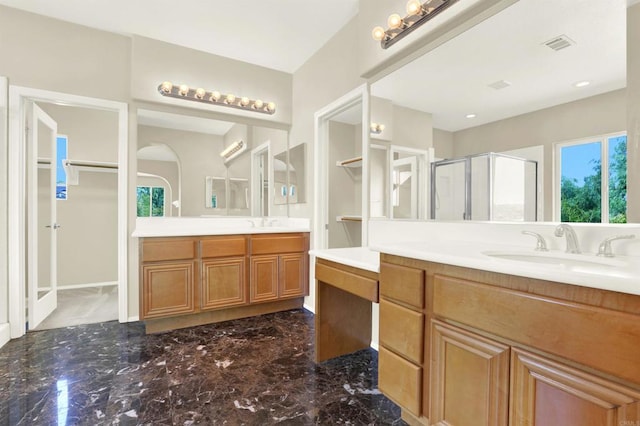 43883 Brookhaven Ct, Temecula, CA 92592 - full bathroom with two vanities, a shower stall, marble tiled floors, and a walk in closet