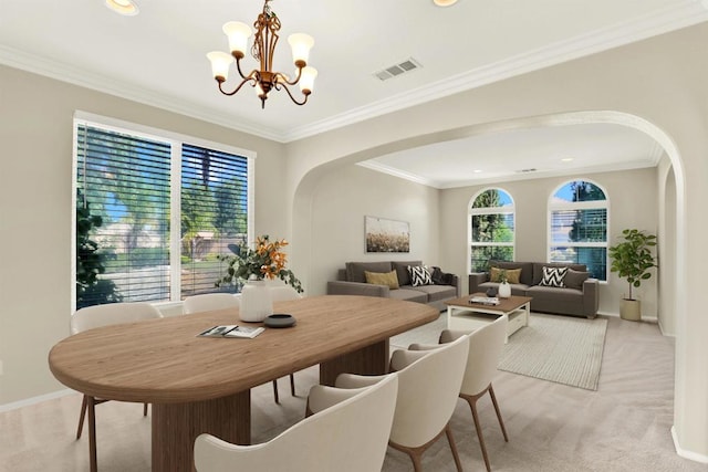43883 Brookhaven Ct, Temecula, CA 92592 - dining area with arched walkways, a chandelier, light colored carpet, ornamental molding, and recessed lighting