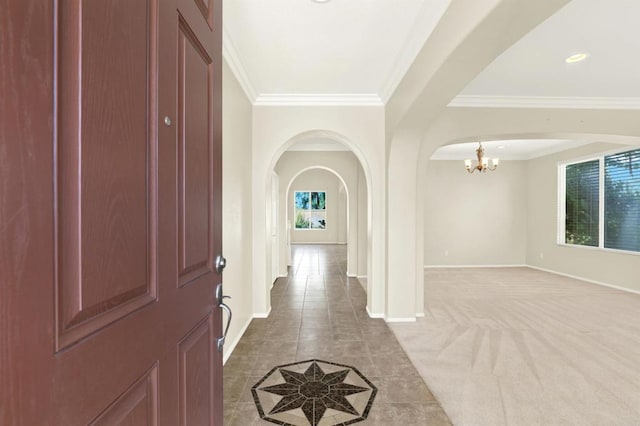 43883 Brookhaven Ct, Temecula, CA 92592 - tiled foyer entrance featuring a chandelier, arched walkways, and ornamental molding