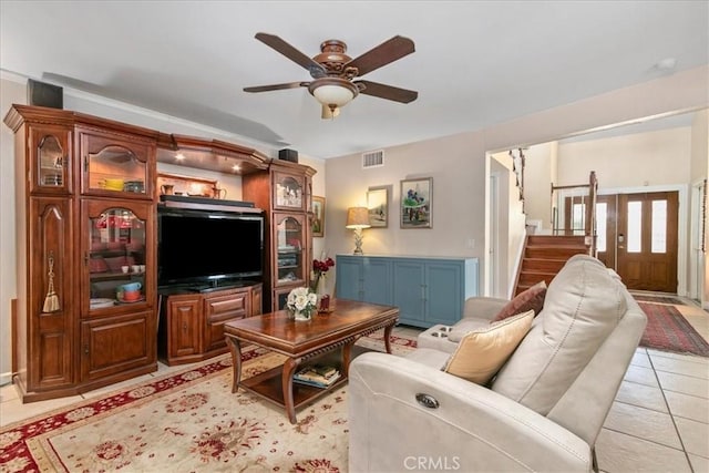 2374 Corydon Ave, Norco, CA 92860 - living area featuring a ceiling fan, stairway, and light tile patterned floors