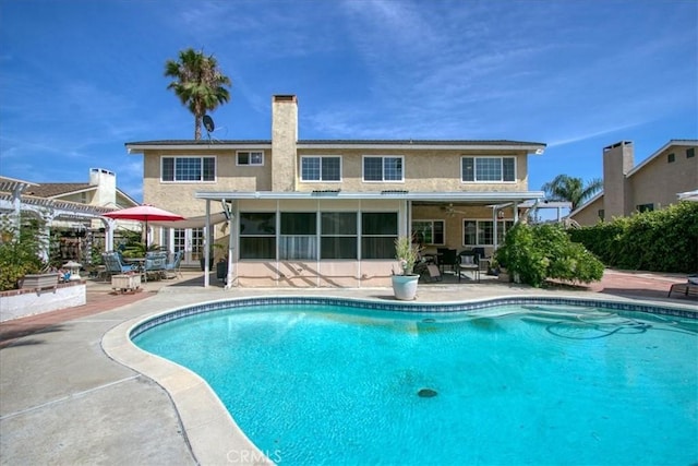 2374 Corydon Ave, Norco, CA 92860 - swimming pool with a patio area, a pergola, and a sunroom
