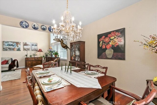 2374 Corydon Ave, Norco, CA 92860 - dining space featuring a chandelier and wood finished floors