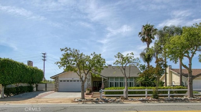 2374 Corydon Ave, Norco, CA 92860 - single story home featuring concrete driveway, stone siding, and an attached garage