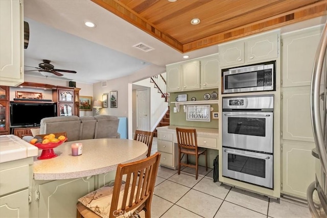 2374 Corydon Ave, Norco, CA 92860 - kitchen featuring stainless steel appliances, light tile patterned flooring, wood ceiling, light countertops, and ceiling fan