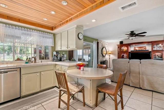 2374 Corydon Ave, Norco, CA 92860 - kitchen with stainless steel dishwasher, light tile patterned flooring, wooden ceiling, a peninsula, and a breakfast bar area