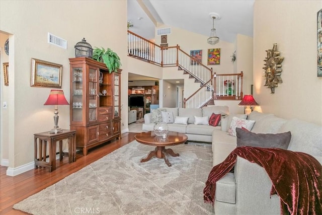 2374 Corydon Ave, Norco, CA 92860 - living area with wood finished floors, stairs, and high vaulted ceiling