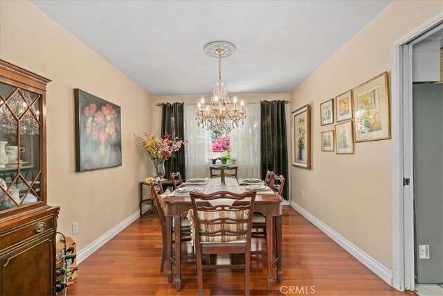 2374 Corydon Ave, Norco, CA 92860 - dining room with a chandelier and wood finished floors