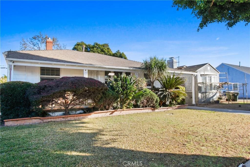 9630 S 8th Ave, Inglewood, CA 90305 - ranch-style home with a chimney and a front yard