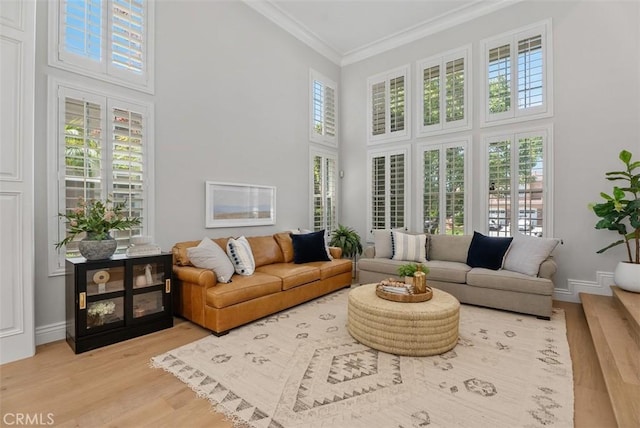 19256 Jasper Hill Rd, Lake Forest, CA 92679 - living room featuring a high ceiling, wood finished floors, ornamental molding, and healthy amount of natural light