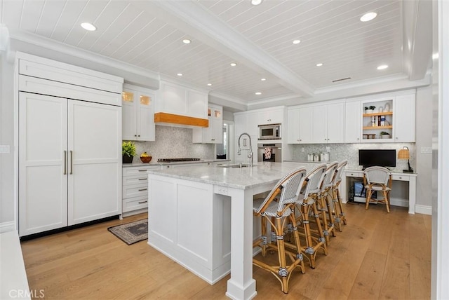 19256 Jasper Hill Rd, Lake Forest, CA 92679 - kitchen with built in appliances, recessed lighting, light wood-style flooring, backsplash, and ornamental molding