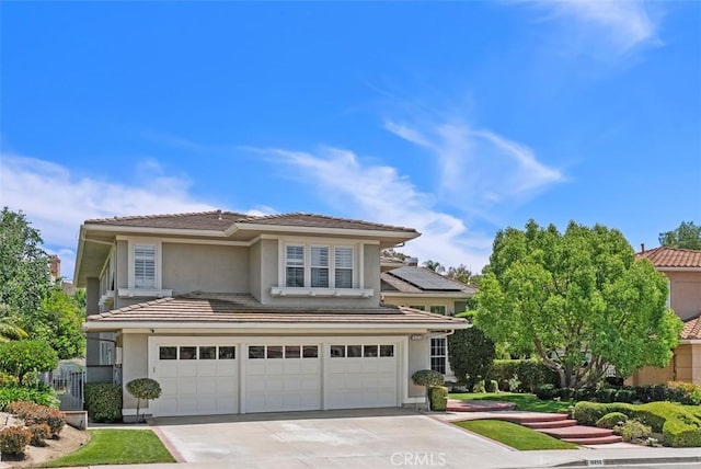 19256 Jasper Hill Rd, Lake Forest, CA 92679 - traditional home featuring an attached garage, concrete driveway, stucco siding, and a tiled roof