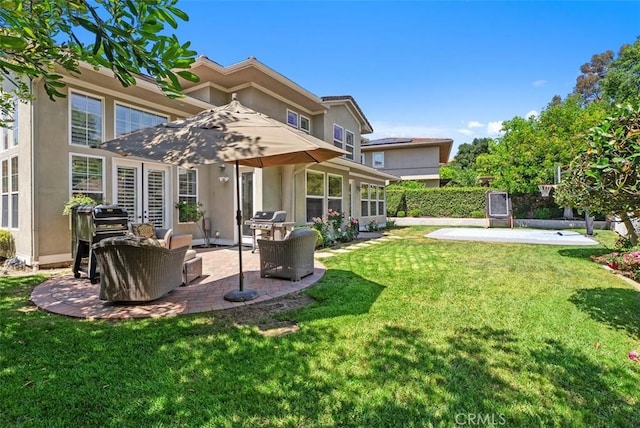 19256 Jasper Hill Rd, Lake Forest, CA 92679 - back of property with a patio area, stucco siding, and a yard