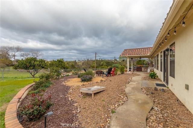 5027 Sleeping Indian Rd, Fallbrook, CA 92028 - view of yard featuring an outdoor fire pit, a patio area, and ceiling fan