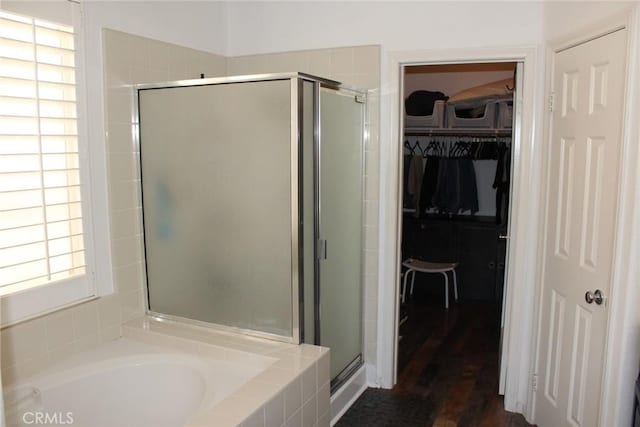 31256 Firestone St, Temecula, CA 92591 - full bath featuring a shower stall, a bath, a spacious closet, and wood finished floors
