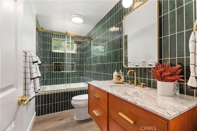 5825 Paseo De La Cumbre, Yorba Linda, CA 92887 - bathroom featuring tile walls, wood finished floors, tiled shower / bath, and vanity