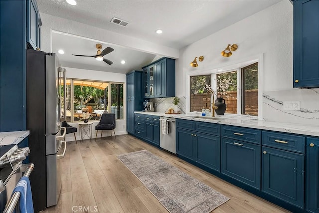 5825 Paseo De La Cumbre, Yorba Linda, CA 92887 - kitchen featuring blue cabinetry, appliances with stainless steel finishes, healthy amount of natural light, recessed lighting, and beam ceiling