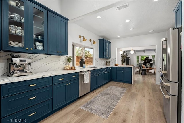 5825 Paseo De La Cumbre, Yorba Linda, CA 92887 - kitchen with appliances with stainless steel finishes, blue cabinets, a peninsula, tasteful backsplash, and glass insert cabinets