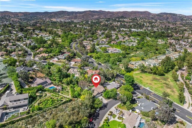 5825 Paseo De La Cumbre, Yorba Linda, CA 92887 - aerial view of property and surrounding area featuring mountains and nearby suburban area
