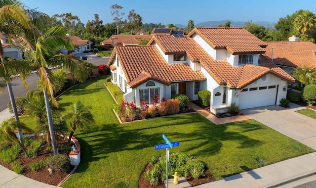 2044 Columbus Way, Vista, CA 92081 - mediterranean / spanish-style house with stucco siding, driveway, an attached garage, a tile roof, and a front lawn