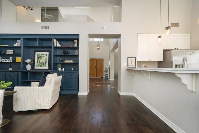 2044 Columbus Way, Vista, CA 92081 - living room with dark wood finished floors, ceiling fan, and a high ceiling