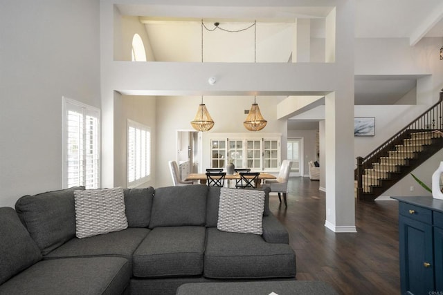 2044 Columbus Way, Vista, CA 92081 - living room featuring dark wood finished floors, a high ceiling, plenty of natural light, and stairway