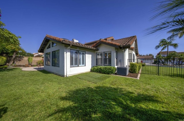 2044 Columbus Way, Vista, CA 92081 - back of property with a fenced backyard, a chimney, stucco siding, and a tile roof