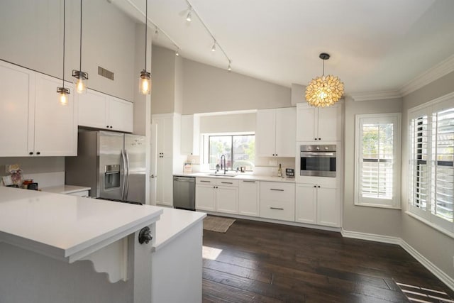 2044 Columbus Way, Vista, CA 92081 - kitchen featuring stainless steel appliances, light countertops, white cabinets, a peninsula, and ornamental molding