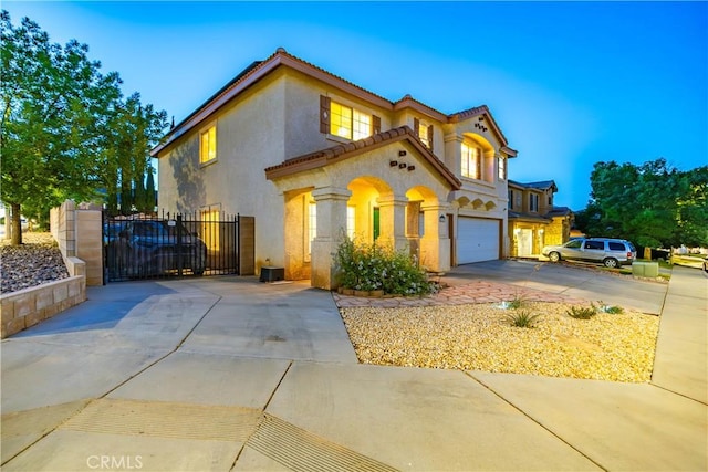 40209 Chelsea Ct, Palmdale, CA 93551 - mediterranean / spanish-style home with driveway, stucco siding, a gate, a garage, and a tiled roof